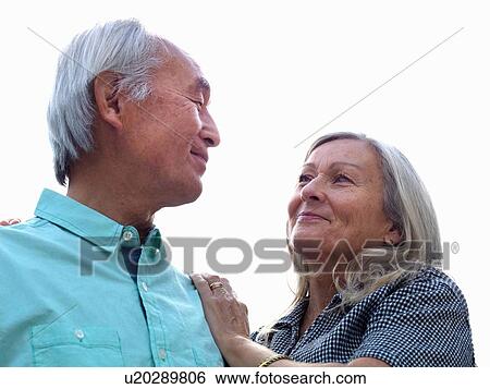 Stock Photograph - Older couple smiling together. Fotosearch