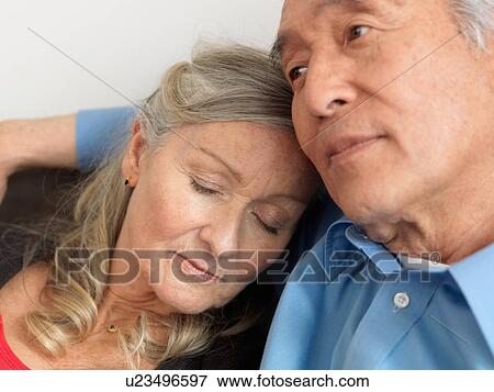 Older woman napping on husband View Large Photo Image Stock Photo - Older woman napping on husband. Fotosearch