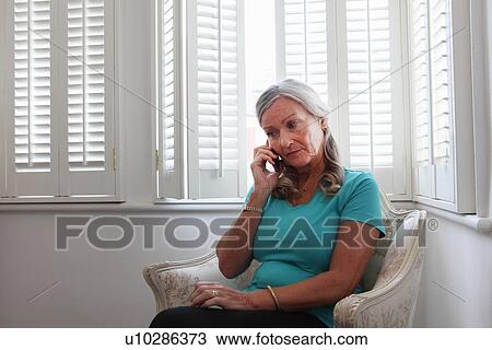 Older woman talking on cell phone View Large Photo Image Stock Image - Older woman talking on cell phone. Fotosearch