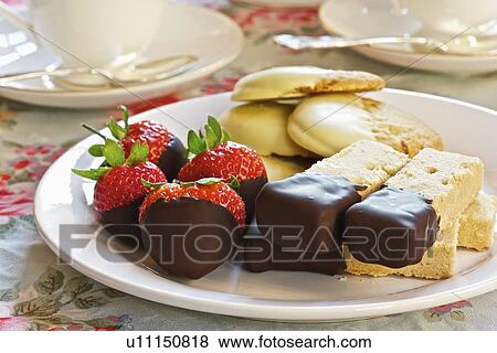 Stock Photo - Plate of chocolate dipped desserts. Fotosearch