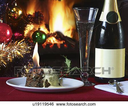 Plate of flaming Christmas pudding View Large Photo Image Stock Photograph - Plate of flaming Christmas pudding. Fotosearch
