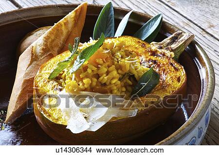 Plate of risotto stuffed pumpkin View Large Photo Image Picture - Plate of risotto stuffed pumpkin. Fotosearch