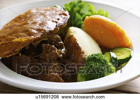 Plate of steak and kidney pie View Large Photo Image Stock Photo - Plate of steak and kidney pie. Fotosearch