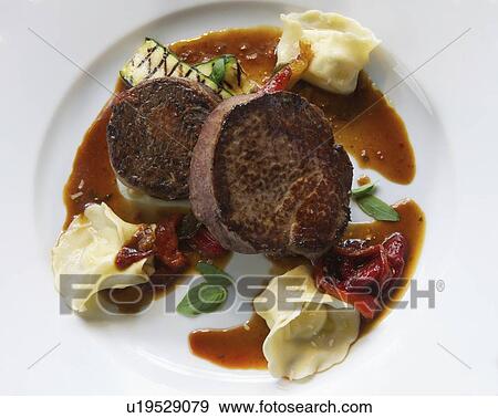 Plate of steak with dumplings View Large Photo Image Stock Photo - Plate of steak with dumplings. Fotosearch