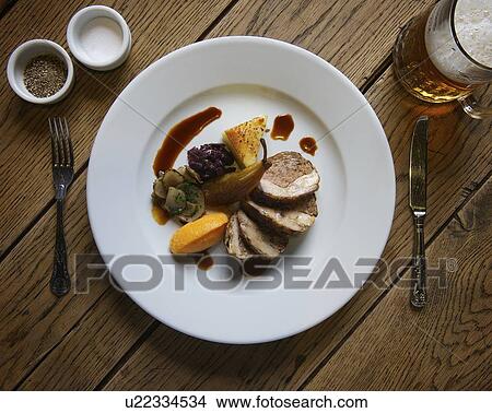 Plate of stuffed pork with pear View Large Photo Image Picture - Plate of stuffed pork with pear. Fotosearch