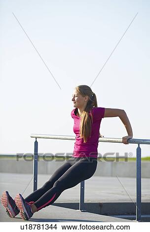 Runner stretching on rooftop View Large Photo Image Picture - Runner stretching on rooftop. Fotosearch