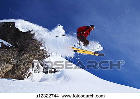Skier jumping on snowy slope View Large Photo Image Picture - Skier jumping on snowy slope. Fotosearch
