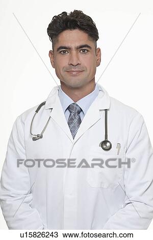 Stock Image - Smiling doctor wearing stethoscope. Fotosearch