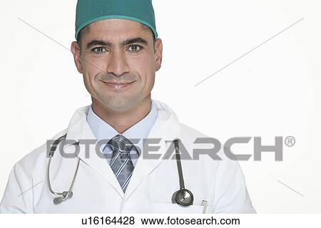 Stock Photo - Smiling doctor wearing stethoscope. Fotosearch