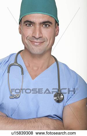 Stock Photo - Smiling surgeon wearing stethoscope. Fotosearch