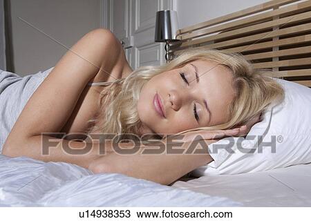 Smiling woman asleep in bed View Large Photo Image Stock Image - Smiling woman asleep in bed. Fotosearch