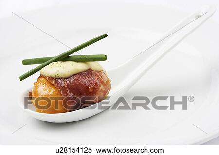 Stock Photography - Spoon of scallop with pancetta. Fotosearch