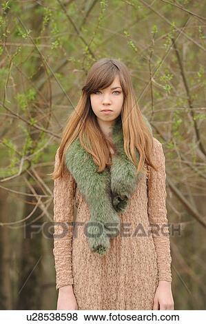 Teenage girl wearing fur scarf outdoors View Large Photo Image Stock Photo - Teenage girl wearing fur scarf outdoors. Fotosearch