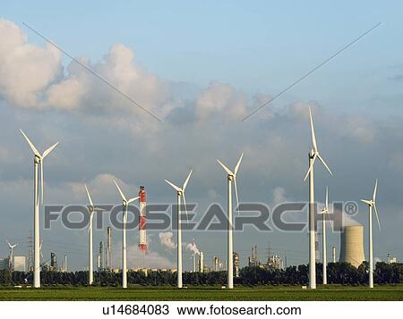 Wind turbines with nuclear smokestack View Large Photo Image Stock Image - Wind turbines with nuclear smokestack. Fotosearch