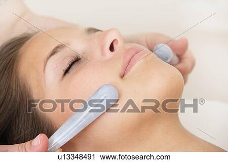Woman having hot stone massage in spa View Large Photo Image Stock Image - Woman having hot stone massage in spa. Fotosearch