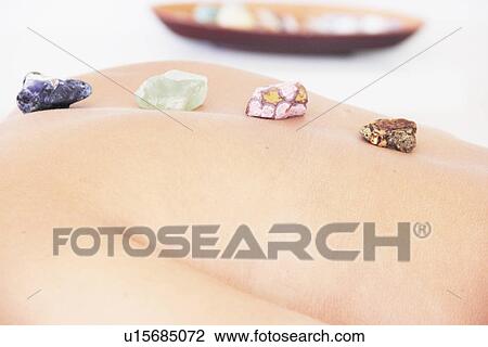 Woman having hot stone massage in spa View Large Photo Image Stock Image - Woman having hot stone massage in spa. Fotosearch