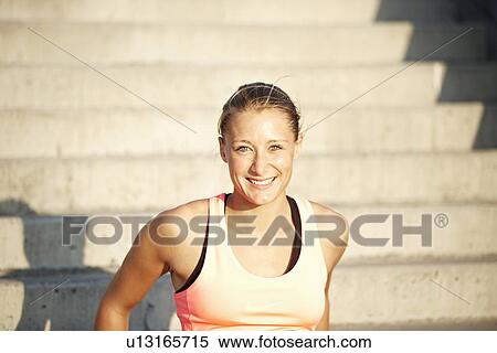 Woman smiling on staircase View Large Photo Image Stock Photography - Woman smiling on staircase. Fotosearch
