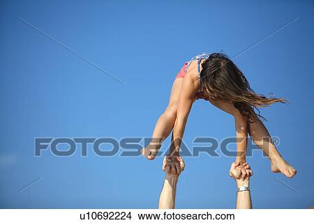Women doing gymnastics on beach View Large Photo Image Picture - Women doing gymnastics on beach. Fotosearch