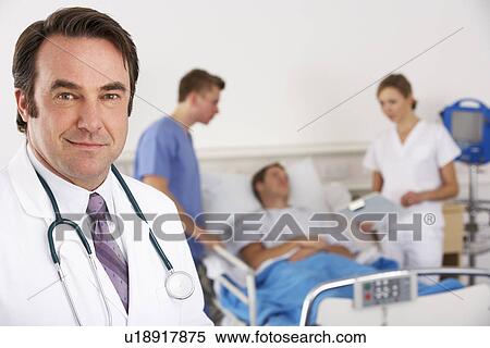 Stock Photography - American doctor and team on hospital ward. Fotosearch