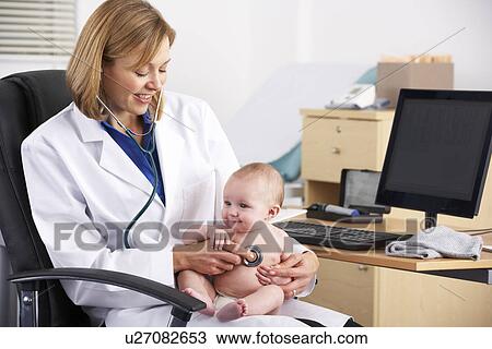 American doctor examining baby View Large Photo Image Stock Image - American doctor examining baby. Fotosearch