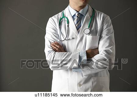 Stock Photography - American doctor studio portrait cropped. Fotosearch