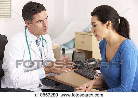 American doctor talking to woman in surgery View Large Photo Image Stock Image - American doctor talking to woman in surgery. Fotosearch