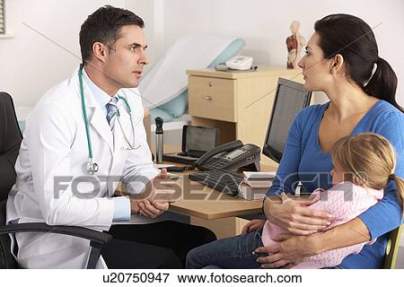 American doctor talking to worried mother View Large Photo Image Stock Photo - American doctor talking to worried mother. Fotosearch