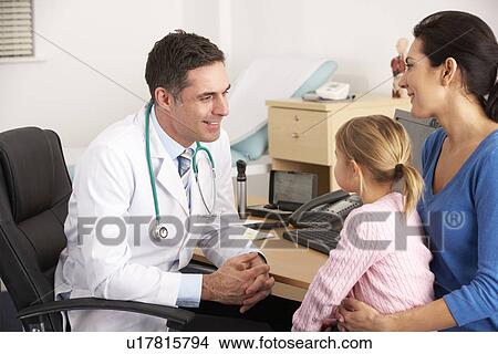 American doctor talking to young child and mother View Large Photo Image Picture - American doctor talking to young child and mother. Fotosearch