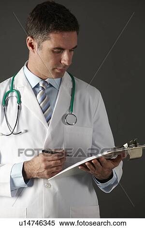 Stock Photography - American doctor with clipboard and stethoscope. Fotosearch