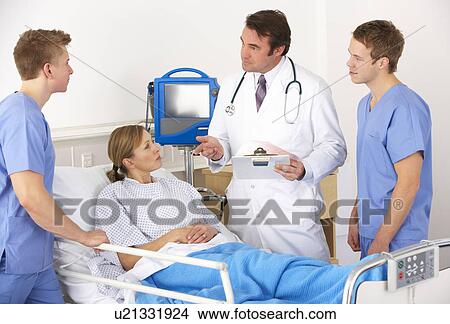 American medical team by patient's bed View Large Photo Image Picture - American medical team by patient's bed. Fotosearch