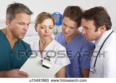 Stock Image - American medical team working on hospital ward. Fotosearch