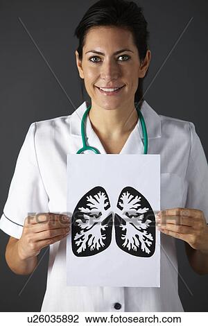 Stock Image - American nurse holding ink drawing of lungs. Fotosearch