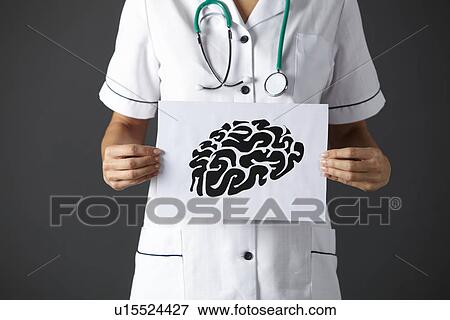 Stock Photo - American nurse holding ink drawing of brain. Fotosearch