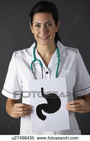 American nurse holding ink drawing of stomach View Large Photo Image Stock Photography - American nurse holding ink drawing of stomach. Fotosearch