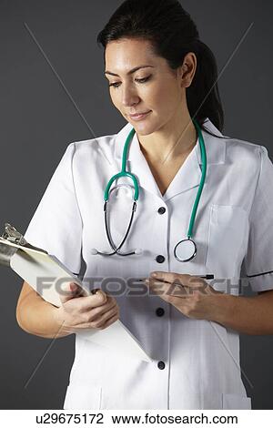 Stock Image - American nurse with stethoscope and clipboard. Fotosearch