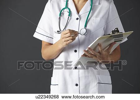 Stock Photo - American nurse with stethoscope and clipboard. Fotosearch