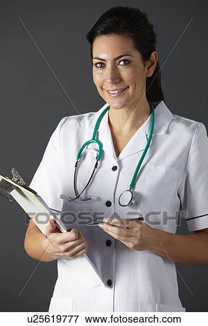 Stock Photo - American nurse with stethoscope and clipboard. Fotosearch