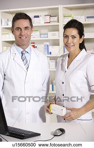 Stock Image - American pharmacists at work. Fotosearch