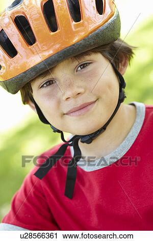 Boy wearing cycling helmet View Large Photo Image Stock Image - Boy wearing cycling helmet. Fotosearch