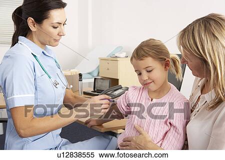 Stock Photography - British nurse giving injection to young child. Fotosearch