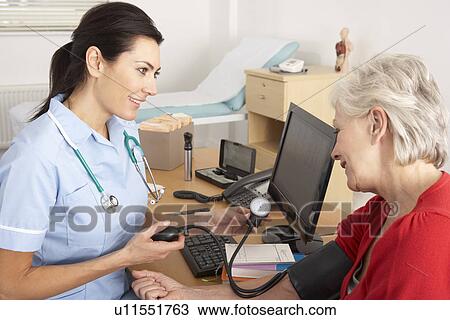 British nurse taking senior woman's blood pressure View Large Photo Image Stock Image - British nurse taking senior woman's blood pressure. Fotosearch