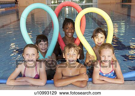 Stock Photo - Children in swimming pool. Fotosearch