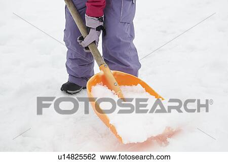 Close Up Of Teenage Girl Shovelling Snow From Path View Large Photo Image Stock Image - Close Up Of Teenage Girl Shovelling Snow From Path. Fotosearch