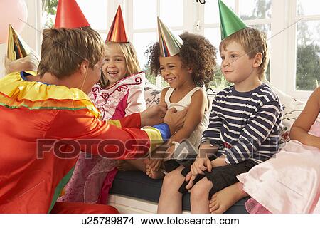 Clown entertaining children at party View Large Photo Image Picture - Clown entertaining children at party. Fotosearch