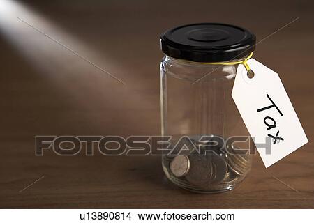 Coins in a jam jar View Large Photo Image Picture - Coins in a jam jar. Fotosearch