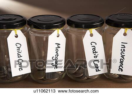 Coins in a jam jar View Large Photo Image Stock Image - Coins in a jam jar. Fotosearch