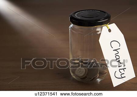 Coins in a jam jar View Large Photo Image Stock Image - Coins in a jam jar. Fotosearch