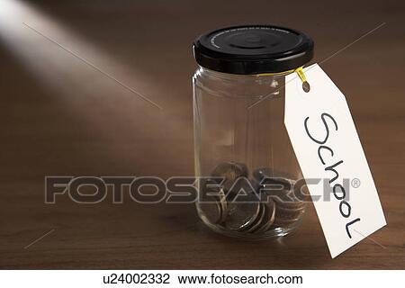 Coins in a jam jar View Large Photo Image Stock Image - Coins in a jam jar. Fotosearch