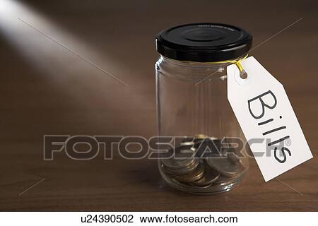 Coins in a jam jar View Large Photo Image Stock Image - Coins in a jam jar. Fotosearch