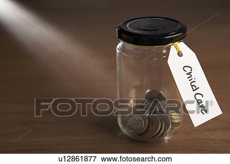 Coins in a jam jar View Large Photo Image Stock Photo - Coins in a jam jar. Fotosearch